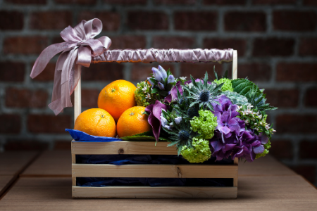 Fundraising ideas for your parent organization from Membership Toolkit. Image of a fruit and flower basket for a silent auction.
