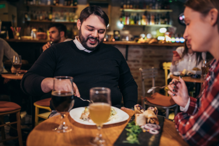Fundraising Ideas for your Parent Organization from Membership Toolkit. Image of 2 people at a restaurant.