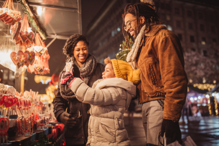 Membership Toolkit fundraising ideas for your parent organization. Image of a family at a holiday mart.