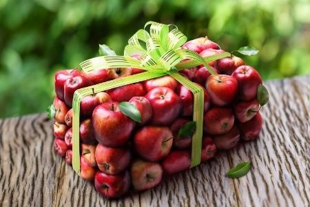 Teacher Appreciation puns from Membership Toolkit. Image of apples wrapped like a gift.